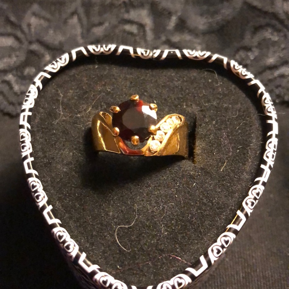 Garnet color stone set in gold tone plated 925